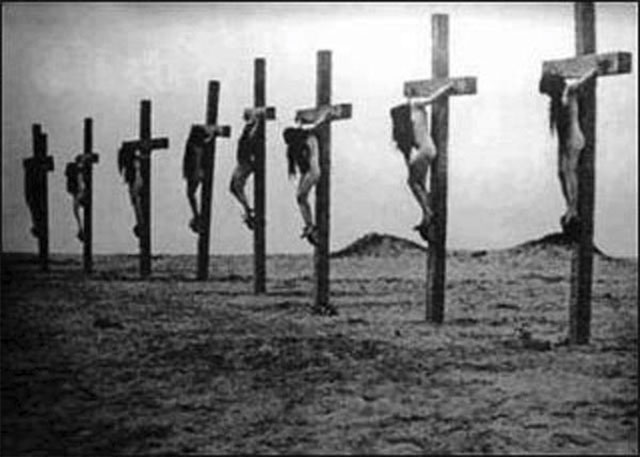 dead Armenians hanging from tall crosses