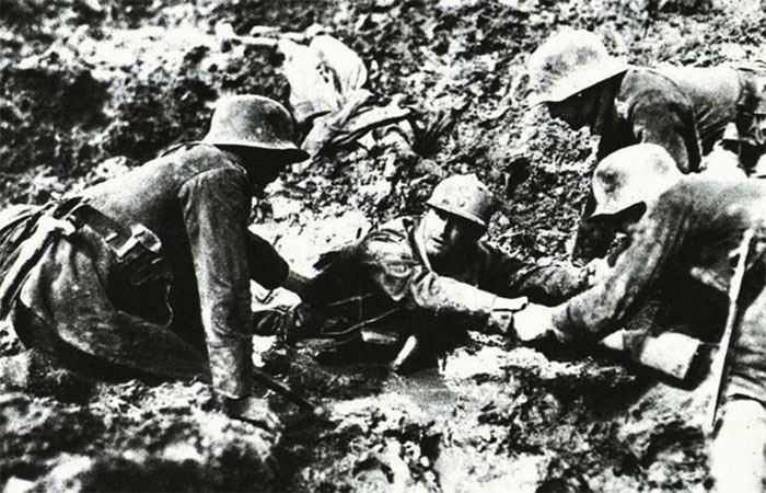 German soldiers help French soldier